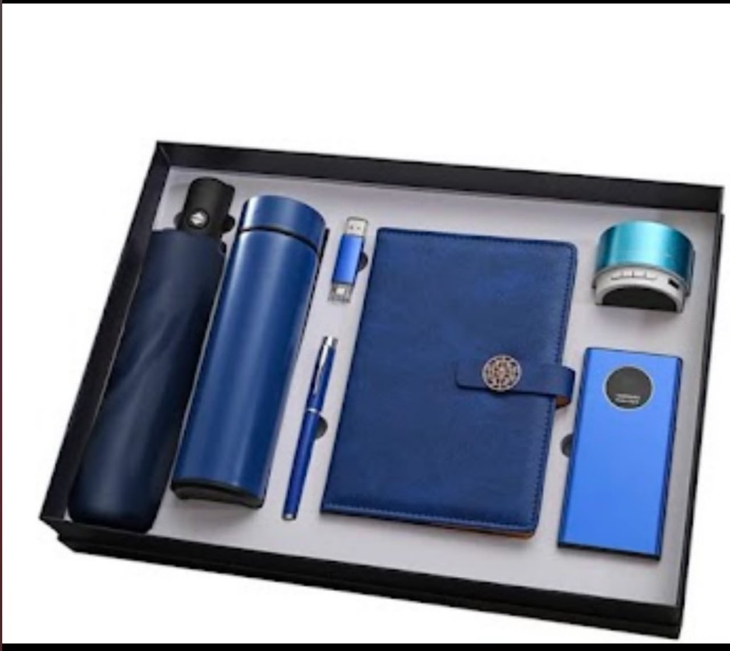 Blue executive gift set with umbrella, thermos, pen, USB, notebook, speaker, and power bank